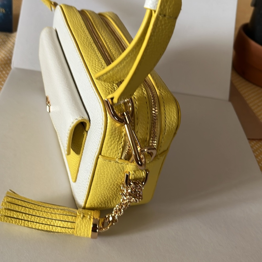 Michael Kors yellow and white camera style bag.